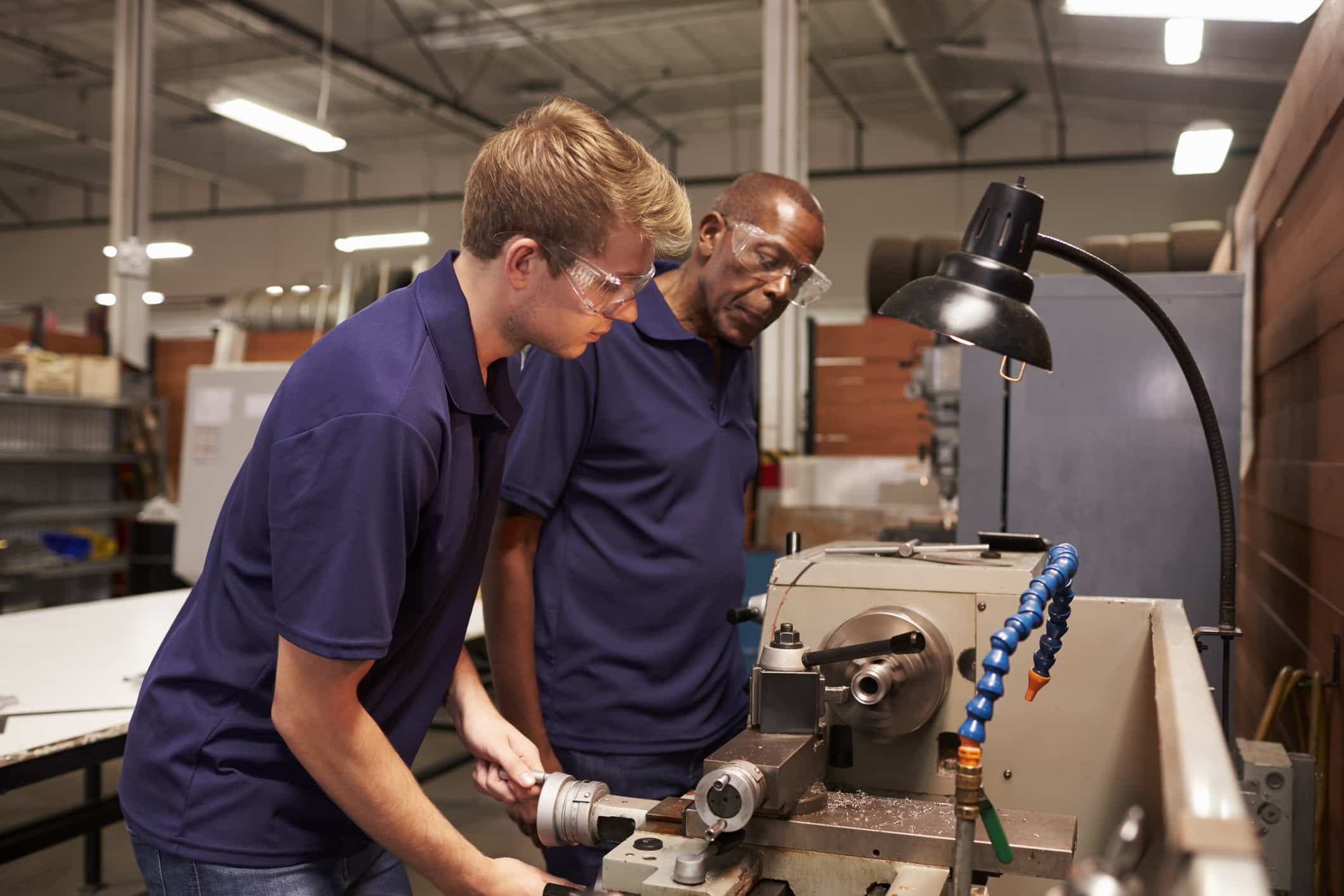 Workers in machine shop working